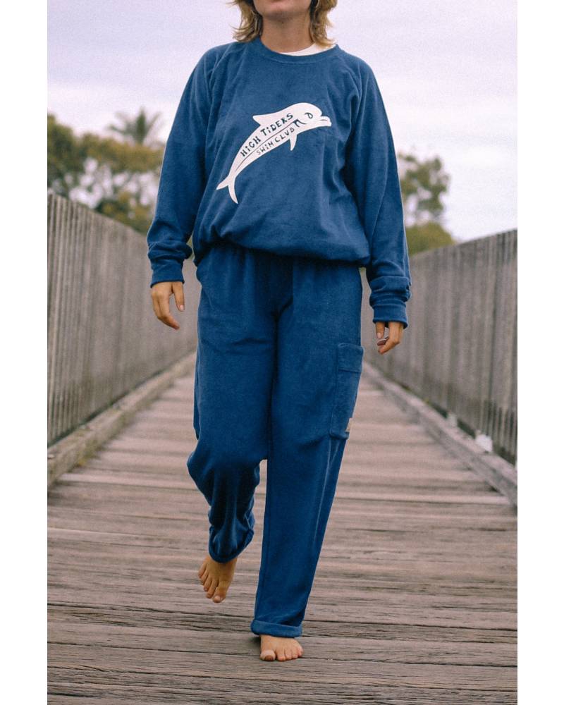Sweater walking on bridge