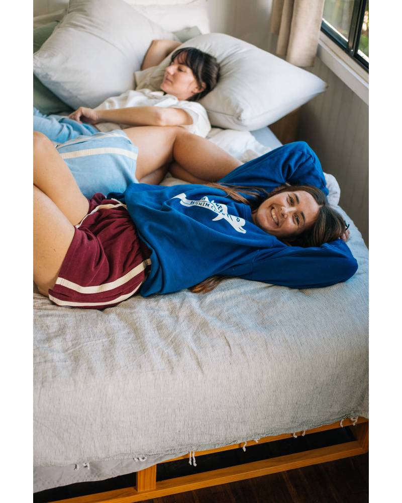 Sweater lounging on bed