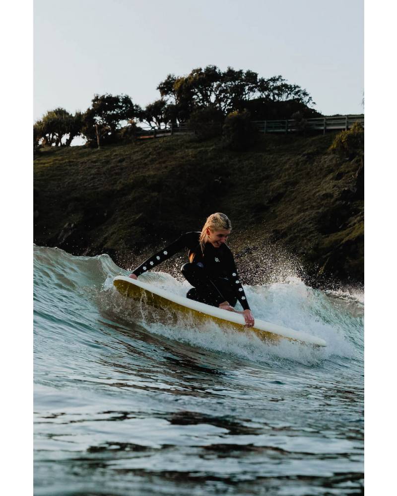 Inner Relm Happy Rider Crop Vest on model at the beach