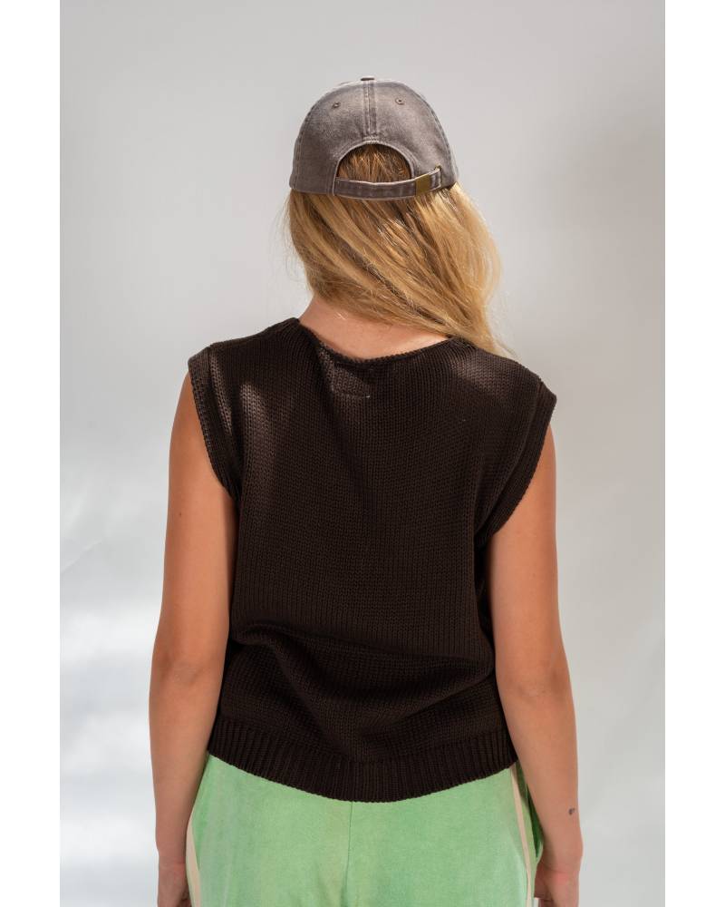 Model in Knit Vest, relaxed pose