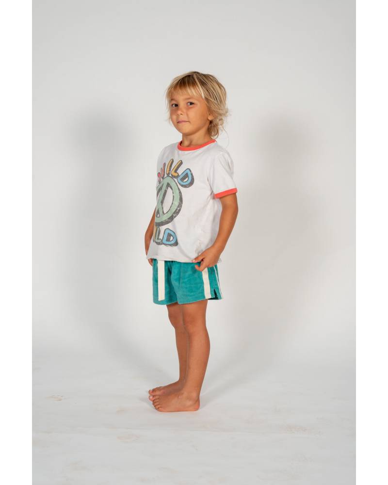 Child on skateboard lying down