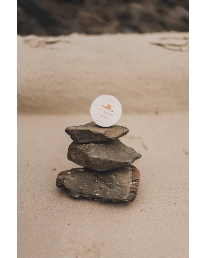 Sun Juju SPF50 Sunscreen on rocks