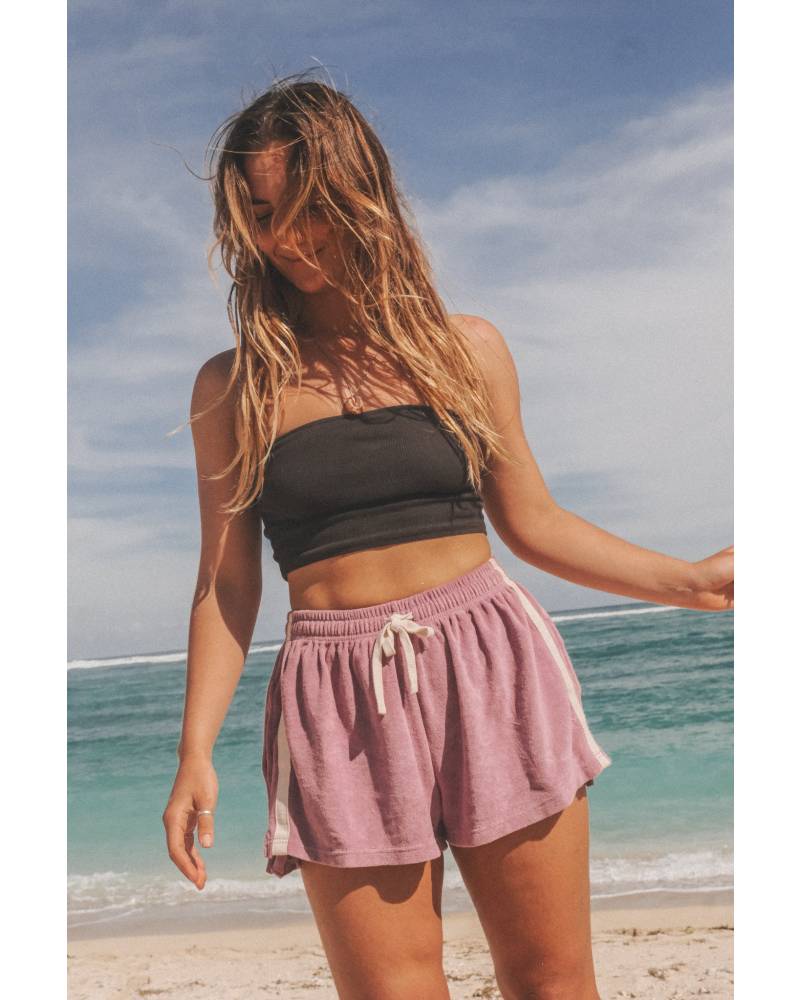 Model on beach with shorts