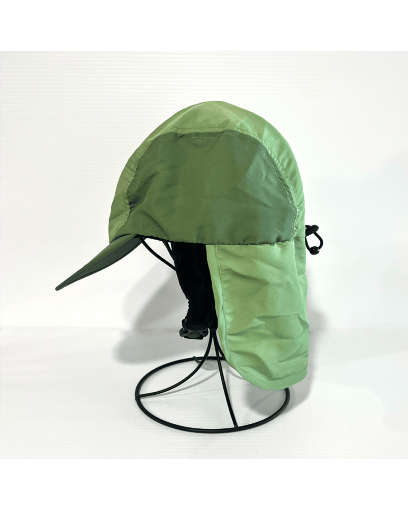 Side view of green surf cap