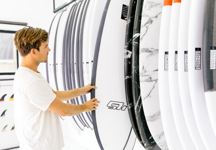 Hayden Cox browsing his range of Haydenshapes surfboards