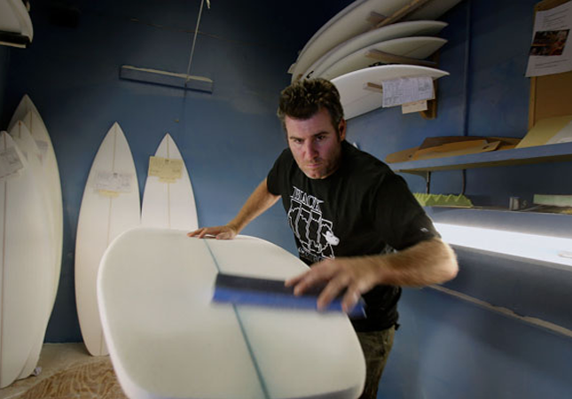 Matt Biolos of lost surfboards working on a Green Foam Blank