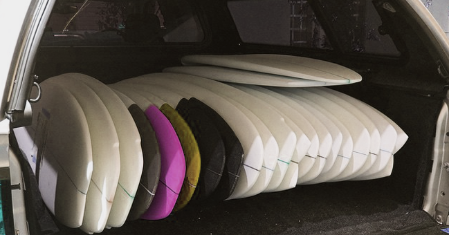boards ready to go in the back of a van